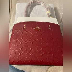 Red/cherry signature Coach tote